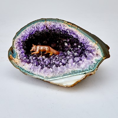 Lot 568 - Continental Carved Carnelian Model of a Fox in an Amethyst Geode Cave