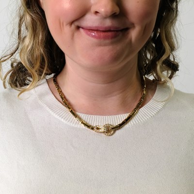 Lot 36 - Cartier Gold and Diamond 'Agrafe' Necklace, France