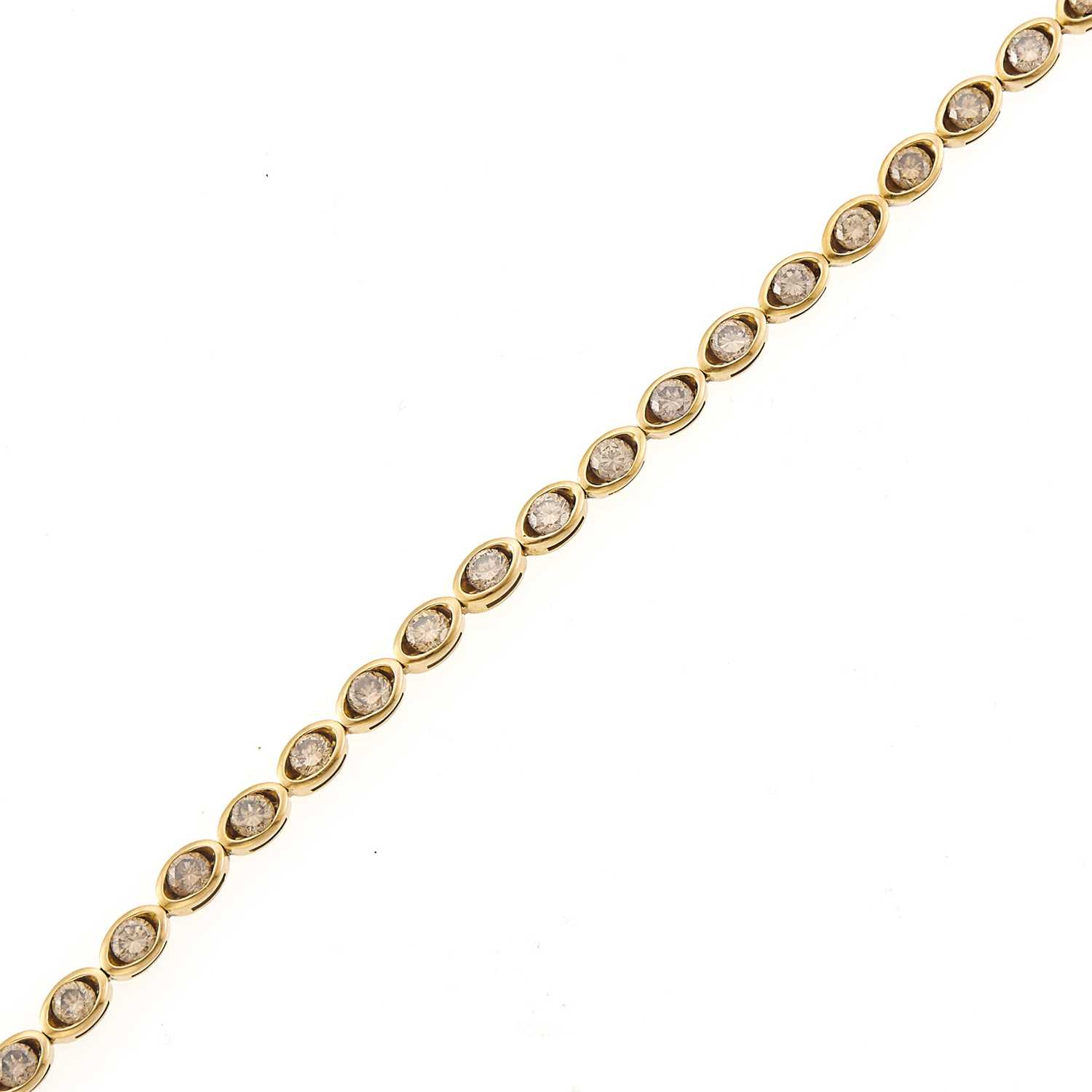 Lot 1072 - Gold and Colored Diamond Bracelet