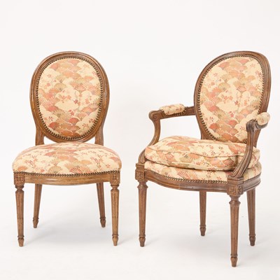 Lot 336 - Set of Eight Louis XVI Style Upholstered Walnut-Stained Fauteuils