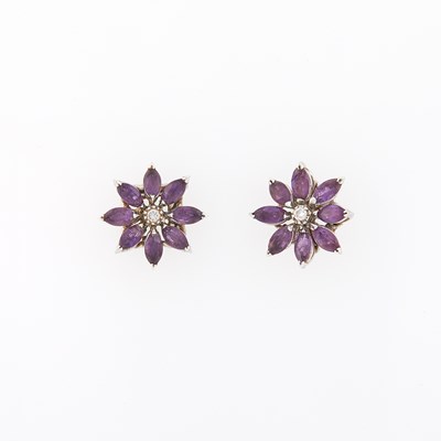 Lot 2318 - Asprey Pair of White Gold, Amethyst and Diamond Flower Earrings