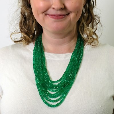 Lot 184 - Nine Strand Emerald Bead Necklace with Antique Silver, Gold and Diamond Flower Clasp