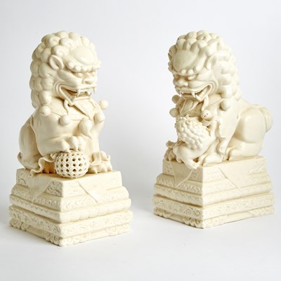 Lot 133 - Pair of Chinese White Glazed Porcelain Foo Lions