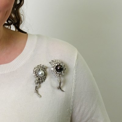 Lot 135 - Pair of Platinum, South Sea and Tahitian Black Cultured Pearl and Diamond Flower Clip-Brooches