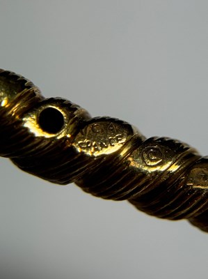 Lot 77 - Georges L'Enfant for Van Cleef & Arpels Pair of Fluted Gold, Platinum and Diamond Bangle Bracelets, France