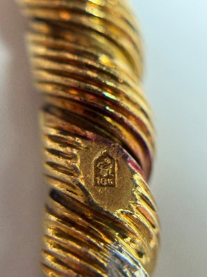 Lot 77 - Georges L'Enfant for Van Cleef & Arpels Pair of Fluted Gold, Platinum and Diamond Bangle Bracelets, France