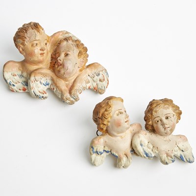 Lot 302 - Two Neapolitan Polychrome Decorated Terracotta Busts of Putti