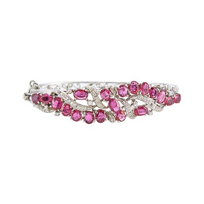 Lot 1134 - White Gold, Ruby and Diamond Bangle Bracelet