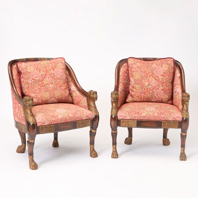 Lot 365 - Pair of Empire Style Parcel-Gilt Mahogany Upholstered Bergères With Lion Head Terminals