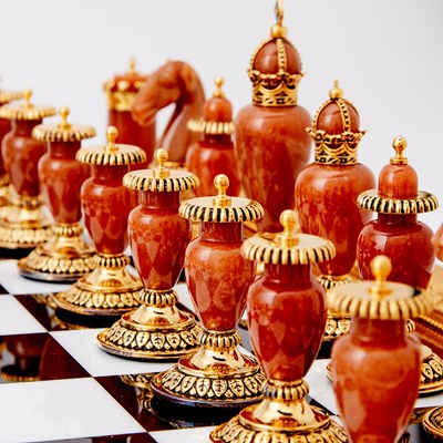 Lot 272 - Modern Fabergé 24 Karat Gold-Plated and Sterling Silver Mounted Hard Stone "Imperial" Chess Set