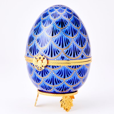 Lot 273 - Modern Fabergé Gilt-Metal Mounted Gilt and Enameled Porcelain Musical Pinecone Egg