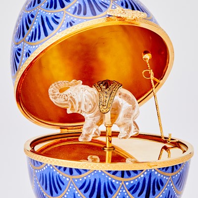 Lot 273 - Modern Fabergé Gilt-Metal Mounted Gilt and Enameled Porcelain Musical Pinecone Egg