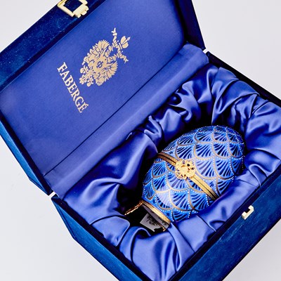 Lot 273 - Modern Fabergé Gilt-Metal Mounted Gilt and Enameled Porcelain Musical Pinecone Egg