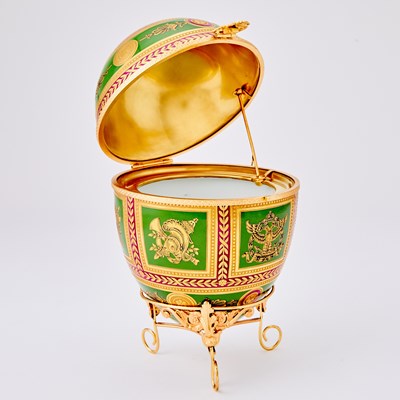 Lot 271 - Tatiana Fabergé Gilt-Metal Mounted Porcelain Egg-Form Box and Stand