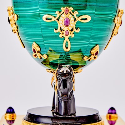 Lot 269 - Modern Fabergé Gilt-Metal Mounted Malachite and Black Agate "Jeweled" Musical Egg