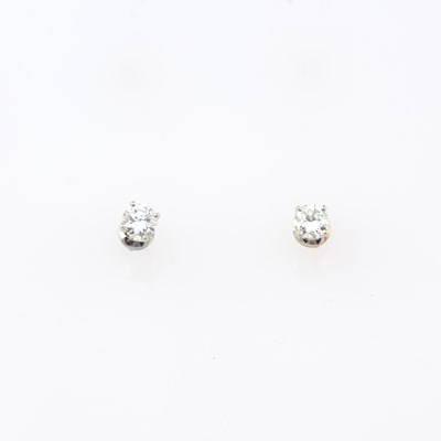 Lot 158 - Two Diamond Solitaire Earrings about 0.90 ct., 14K 1 dwt.