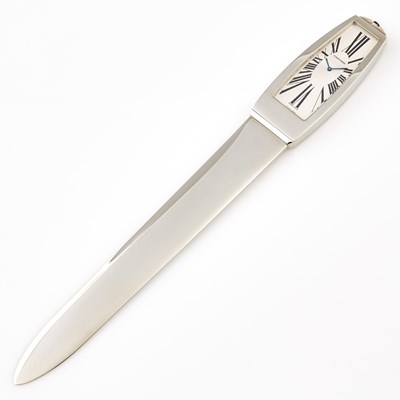 Lot 436 - Stainless Steel Letter Opener with clock with box and papers, bears signature Cartier