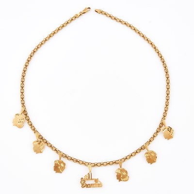 Lot 609 - Gold Necklace with 7 gold charms attached, 14K 11 dwt.