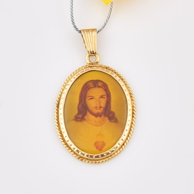 Lot 643 - Gold, Metal and Plastic Pendant, 14K and Metal 3 dwt. all