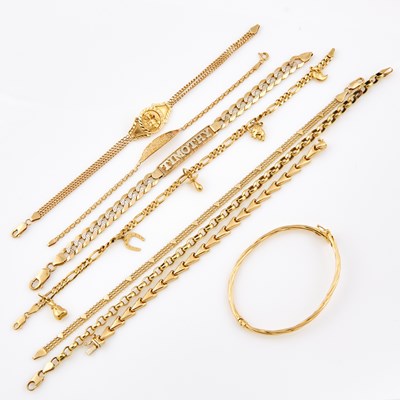 Lot 648 - Eight Gold and Stone Bracelets with 5 charms attached, 14K 32 dwt. and 10K 12 dwt. all, damaged