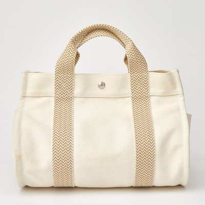 Lot 1202 - Hermès Ivory Canvas 'Cannes PM' Tote