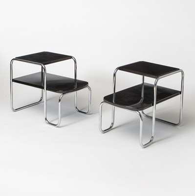 Lot 166 - Pair of Gilbert Rohde Chromed Steel and Black Laminate Two-Tier Tables