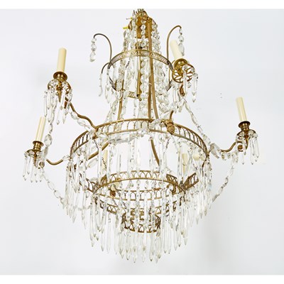 Lot 571 - Baltic Neoclassical Cut-Glass Mounted Brass Nine-Light Chandelier