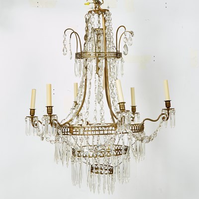 Lot 571 - Baltic Neoclassical Cut-Glass Mounted Brass Nine-Light Chandelier