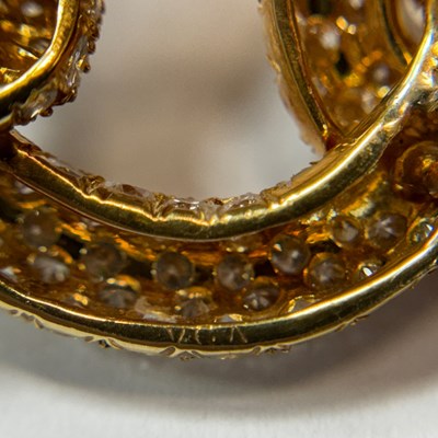 Lot 100 - Gold and Diamond Knot Brooch