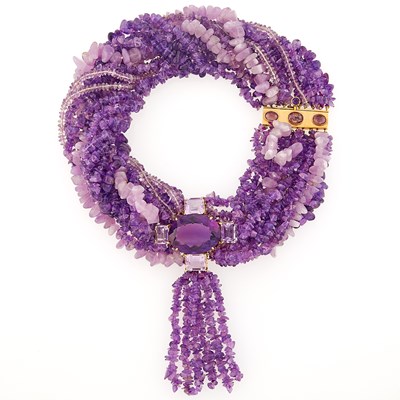 Lot 2144 - Fourteen Strand Tumbled Amethyst Bead, Gold and Amethyst Torsade Tassel Necklace