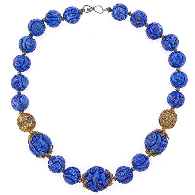 Lot 2105 - Carved Lapis Bead and Silver-Gilt Necklace