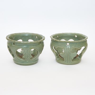 Lot 177 - Two Chinese Longquan Celadon Openwork Brazier Stands