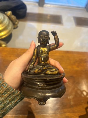 Lot 173 - A Chinese Parcel Gilt Bronze Figure of Infant Buddha on Stand