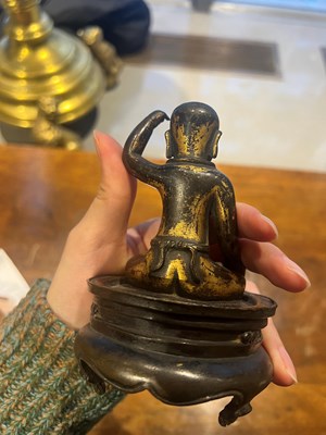 Lot 173 - A Chinese Parcel Gilt Bronze Figure of Infant Buddha on Stand