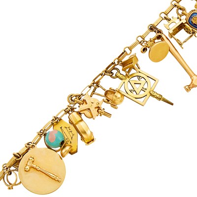 Lot 1091 - Gold and Gilt-Metal Charm Bracelet