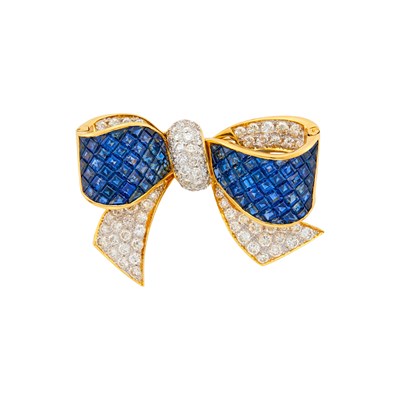 Lot 83 - Two-Color Gold, Invisibly-Set Sapphire and Diamond Bow Clip-Brooch