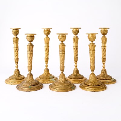 Lot 111 - Set of Seven Louis XVI Style Gilt-Bronze Candlesticks