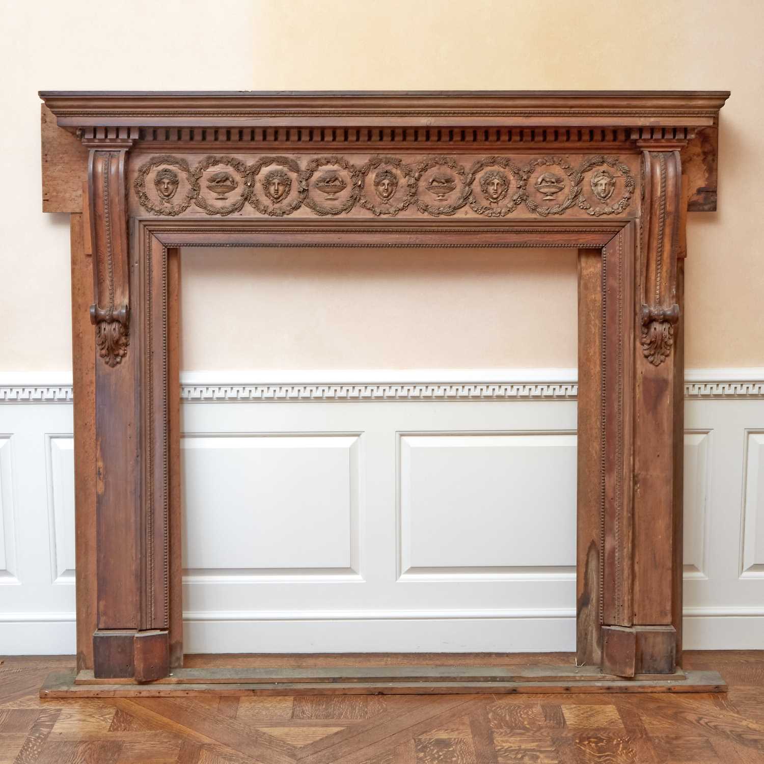 Lot 145 - Continental Neoclassical Walnut Fireplace Surround