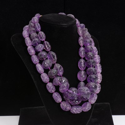 Lot 306 - Three Carved Amethyst Beaded Necklaces