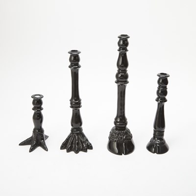 Lot 263 - Set of Four Iris Apfel Black Animal Feet Candlesticks