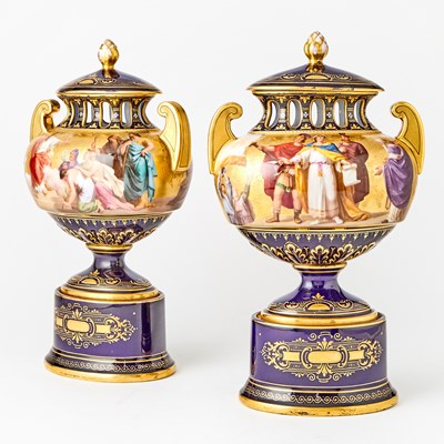 Lot 556 - Pair of Vienna Style Cobalt-Blue and Gold Ground Porcelain Urns and Covers on Pedestals