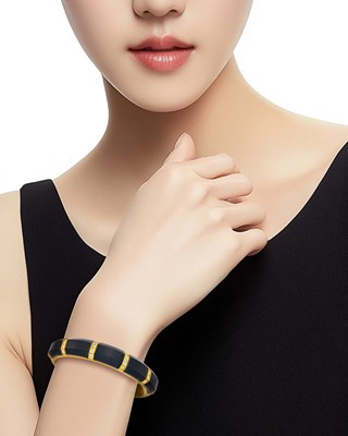 Lot 12 - Gold, Black Onyx and Diamond Bangle Bracelet