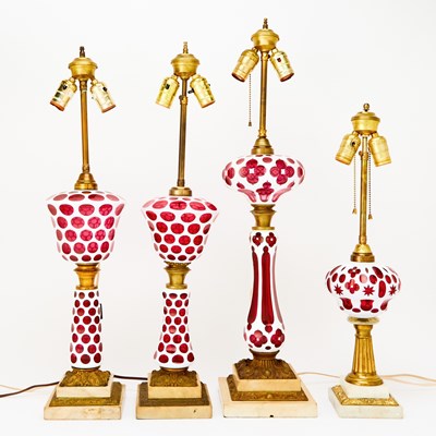 Lot 349 - Four Cranberry Milk Glass Lamps