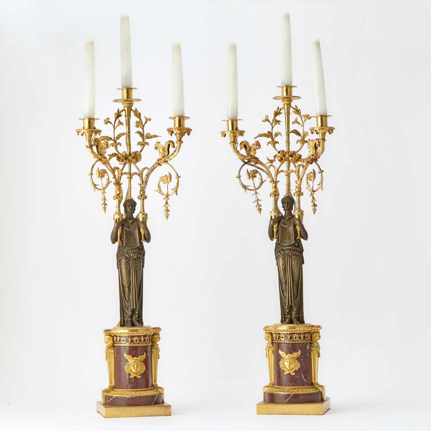 Lot 371 - Pair of Empire Ormolu and Patinated Bronze Red Marble Three-Light Candelabra