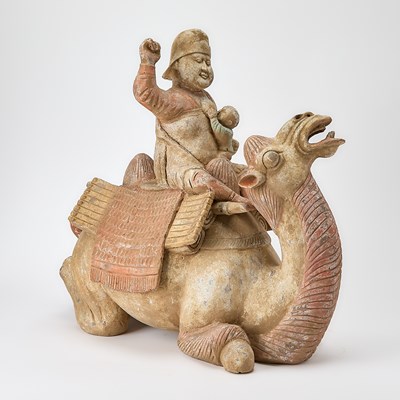 Lot 504 - A Chinese Pottery Figure of a Kneeling Camel and Rider