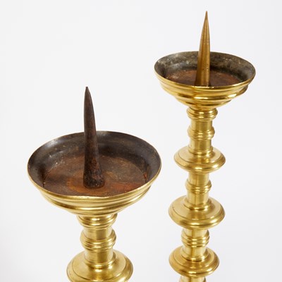 Lot 543 - Pair of South German Brass Pricket Candlesticks