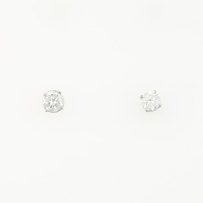 Lot 306 - Two Diamond Solitaire Earrings about 1.15 cts., 14K