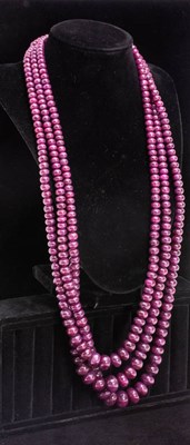 Lot 203 - Triple-Strand Ruby Bead Necklace