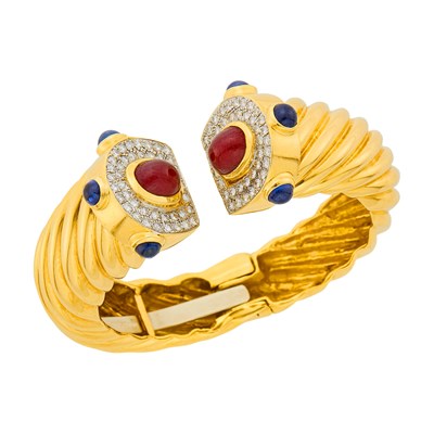 Lot 77 - Fluted Two-Color Gold, Cabochon Ruby and Sapphire and Diamond Bangle Bracelet