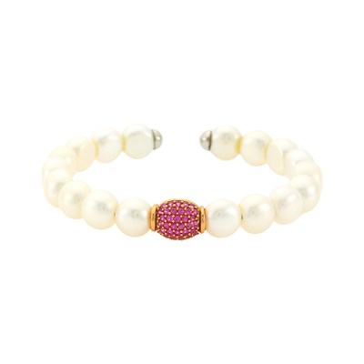 Lot 1161 - Rose Gold, Freshwater Pearl and Ruby Bangle Bracelet